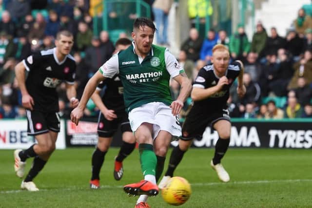 Hibernian's Marc McNulty scores his team's second from the penalty spot. Pic: SNS/Paul Devlin
