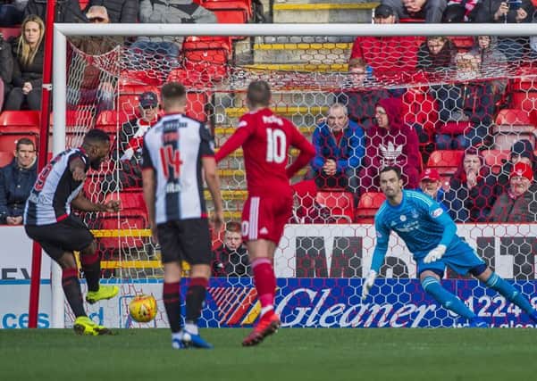 St Mirren's Duckens Nazon scores an early penalty to put the visitors ahead. Pic: SNS/Bill Murray