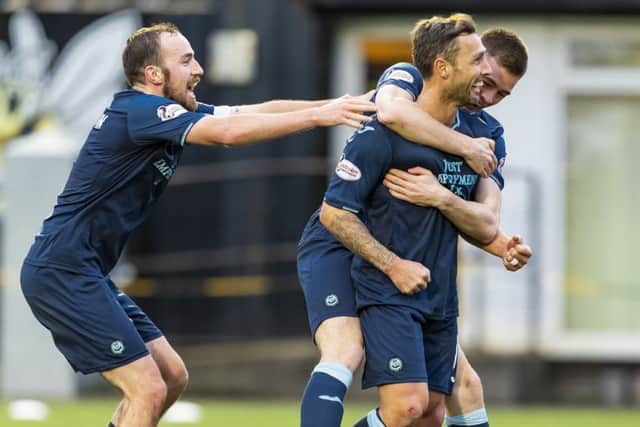 Partick Thistle's Scott McDonald celebrates his goal. Pic: SNS/Roddy Scott