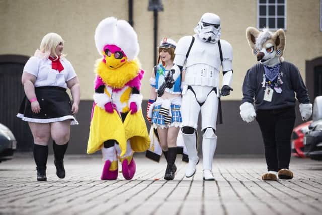 Madison Birrall, Penny Moth, Elise Forrest, an unamed Stormtrooper, and Mitch Houston arrive ahead of the 2019 Capital Sci-Fi Con at the Corn Exchange in Edinburgh. Picture: Jane Barlow