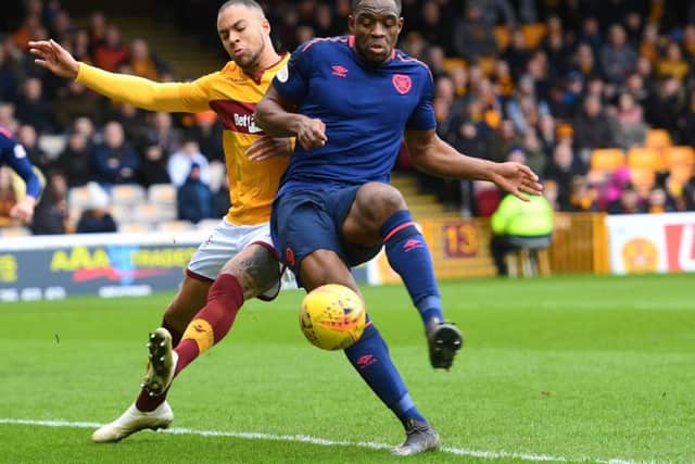 Motherwell's Charles Dunne battles for possession with Uche Ikpeazu of Hearts. Picture: SNS Group