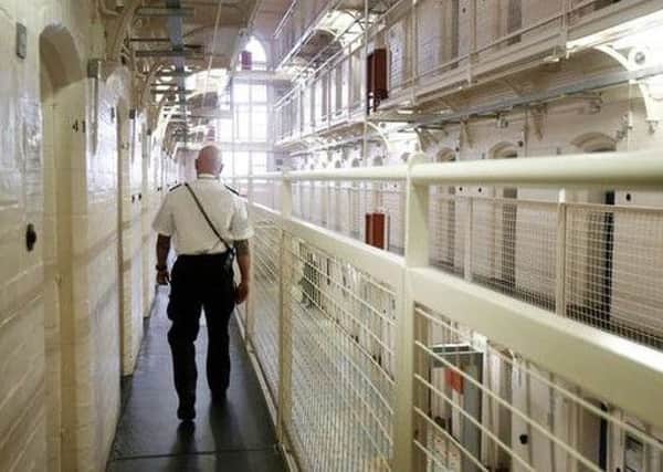 More than 1,400 prisoners in Scotland are being housed in doubled-up single cells. Picture: Danny Lawson/PA