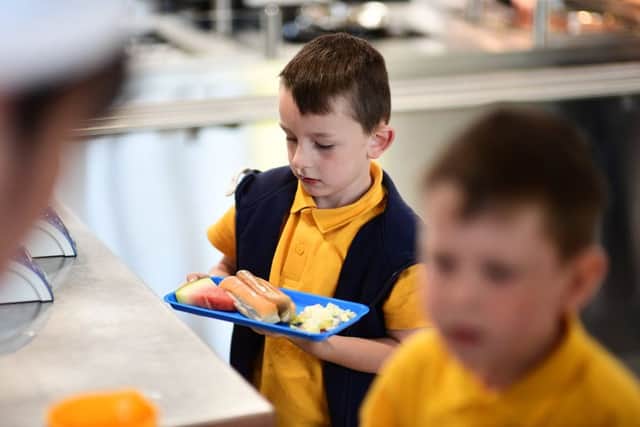 Children get a lunch break at school, but many adults end up eating a sandwich at their desk (Picture: John Devlin)