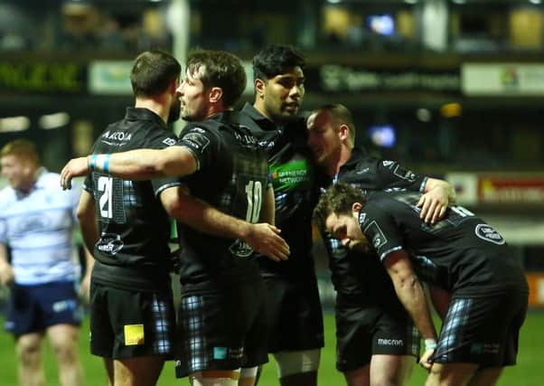 Glasgow Warriors celebrate at the final whistle after victory over Cardiff Blues. Photo: REX/Shutterstock