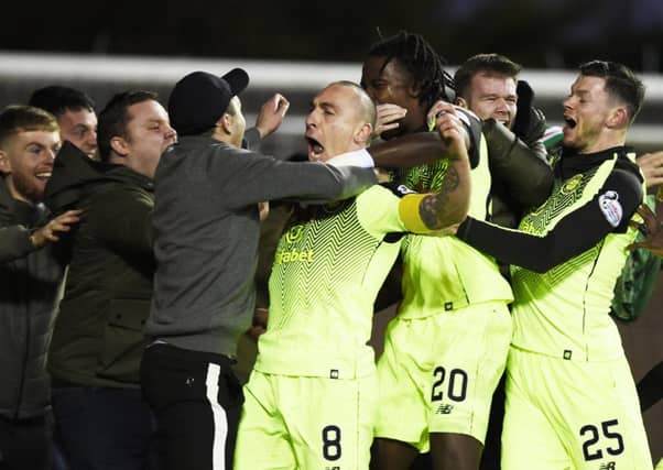 Scott Brown celebrates with the Celtic fans after scoring the winner. Picture: PA