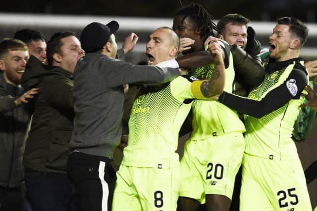 Scott Brown celebrates with the Celtic fans after scoring the winner. Picture: PA