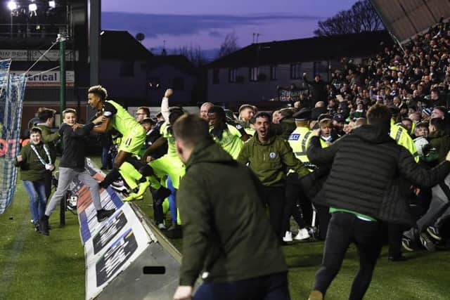 Celtic fans stream onto the pitch following Scott Brown's late winner. Picture: SNS Group