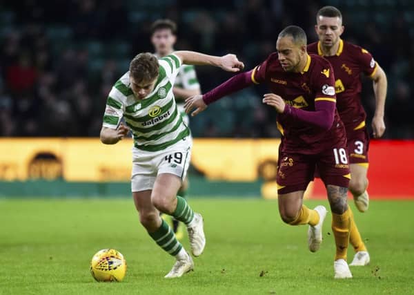 Celtic's James Forrest comes up against Motherwell's Charles Dunne. Picture: SNS/Rob Casey