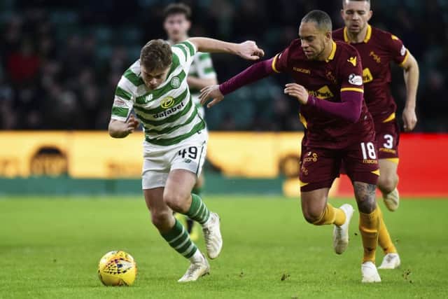 Celtic's James Forrest comes up against Motherwell's Charles Dunne. Picture: SNS/Rob Casey