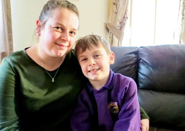 Max MacPhee with mum Louise.  Picture: SWNS