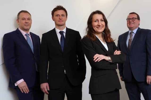 Pictured are chair Bruce Farquhar, left, and managing partner Murray McCall, right, with Gary Burton and Victoria Simpson Picture: Stewart Attwood.