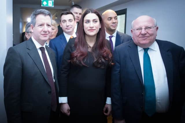 MPs (left to right) Chris Leslie (Ann Coffey, Angela Smith, (both hidden left), Gavin Shuker, Luciana Berger, Chuka Umunna and Mike Gapes, after they announced their resignations from Labour