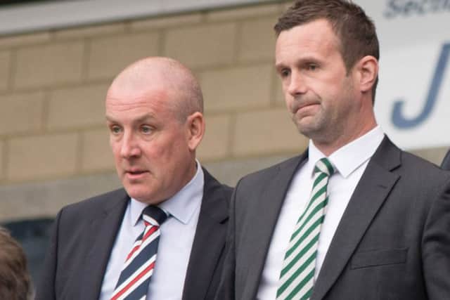 Mark Warburton, left, with Ronny Deila ahead of the Scottish Cup semi-final in April 2016. Picture: SNS Group