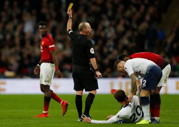 Could we see English referee Mike Dean and his legendary 'no-look' yellow cards in the Scottish Premiership? Picture: Getty Images