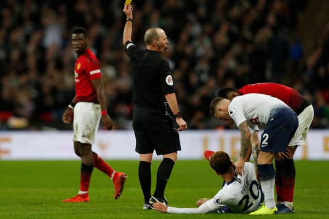 Could we see English referee Mike Dean and his legendary 'no-look' yellow cards in the Scottish Premiership? Picture: Getty Images