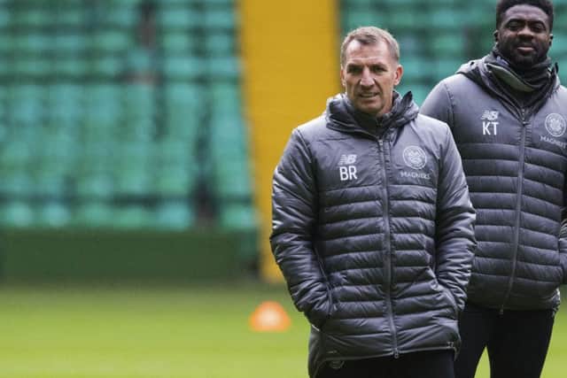 Brendan Rodgers watches on with Kolo Toure during a Celtic training session. Picture: SNS Group