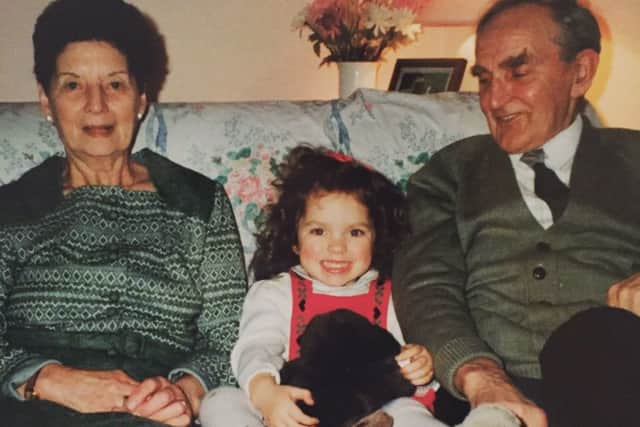 Louisa Davidson (centre) pictured with her grandpa (right) who lived with dementia and grandma (left).