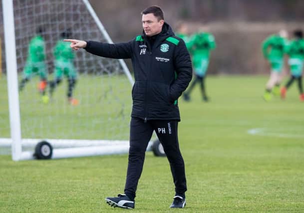 Hibs manager Paul Heckingbottom makes a point as he oversees training. Picture: Ross Parker/SNS