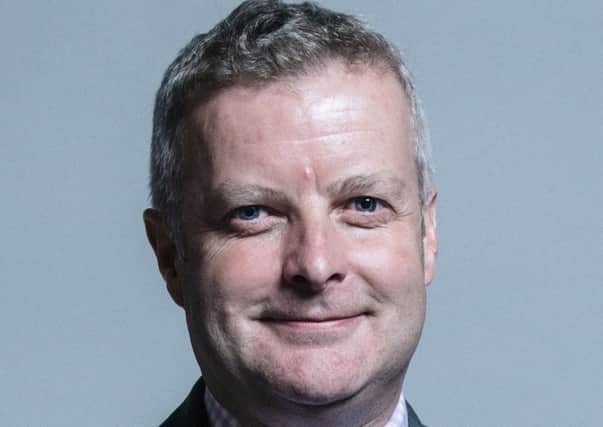 Christopher Davies, the MP for Brecon and Radnor, was charged today by police