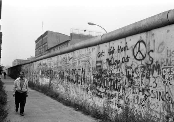 Parts of the Berlin Wall  erected to prevent people fleeing from Communist East Germany to the democratic West  have been preserved to ensure no one forgets this appalling time (Picture: Brian Stewart)