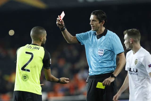 Jeremy Toljan receives his second yellow card during the first half. Picture: AP