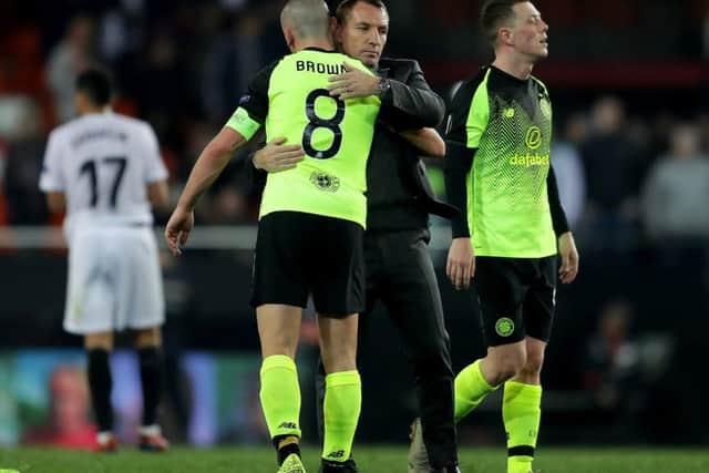 Brendan Rodgers embraces captain Scott Brown at full time. Picture: Getty