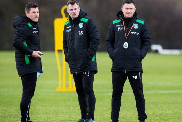 New Hibernian manager Paul Heckingbottom, right, with coach Grant Murray, left, and assistant manager Robbie Stockdale. Picture: Ross Parker/SNS
