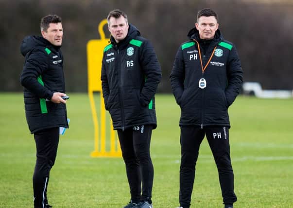 New Hibernian manager Paul Heckingbottom, right, with coach Grant Murray, left, and assistant manager Robbie Stockdale. Picture: Ross Parker/SNS