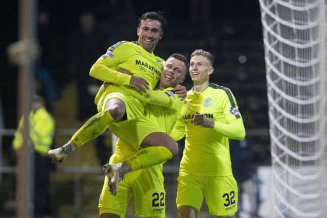 Hibs' Florian Kamberi hoists Stevie Mallan in the air following the midfielder's stunning second-half strike. Picture: Craig Foy/SNS