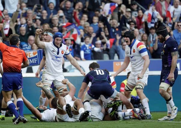 France's players react after back row Greg Alldritt scored a try. Pic: Thomas Samson/AFP/Getty Images