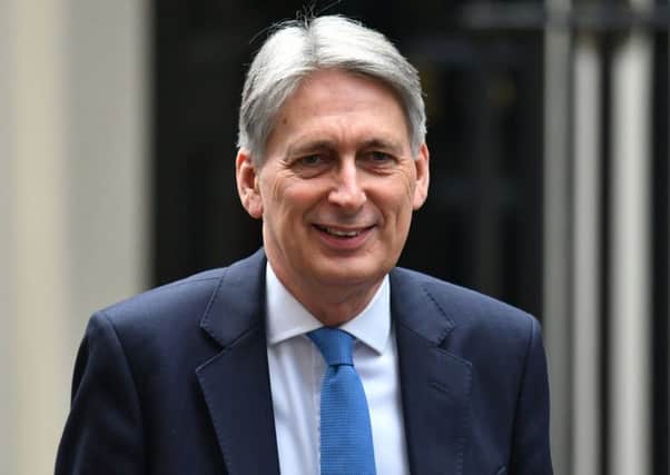 Philip Hammond could decide to end austerity for other Government departments with the budget deficit at historic lows (Picture: Dominic Lipinski/PA Wire)
