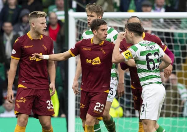 Kieran Tierney exchanges words with Motherwell's James Scott (left) and Alex Rodriguez Gorrin. Picture: SNS