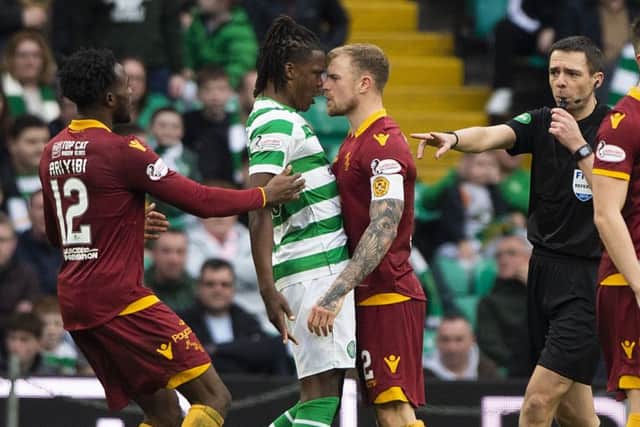 Celtic defender Dedryck Boyata and Motherwell's Richard Tait exchange words after the away side pull a goal back. Picture: SNS