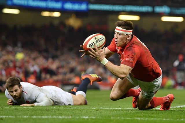 Englands Elliot Daly can only watch on in anguish as Josh Adams touches down for Wales match-clinching second try.
Picture: Dan Mullan/Getty Images