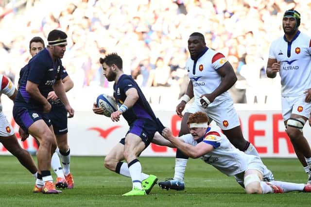 Scotland winger Tommy Seymour is tackled by France lock Felix Lambey at the Stade de France. Picture: AFP/Getty Images