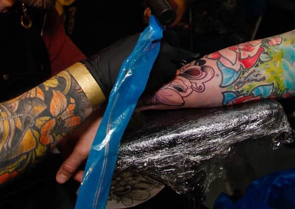 Getting a tattoo is now more popular than ever. Picture: TSPL