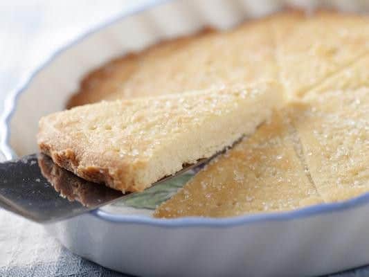 Derived from medieval biscuit bread, Scottish shortbread is traditionally formed into one of three shapes  petticoat tails, shortbread rounds, or fingers  and is famed for its deliciously buttery taste.