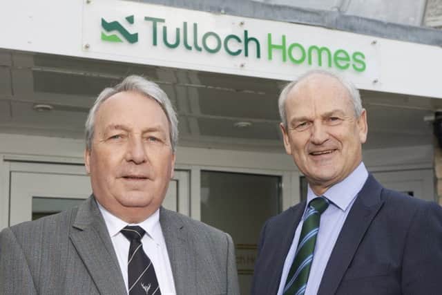 Keith Loades, Camanachd Association president, with Tulloch Homes chief executive George Fraser.