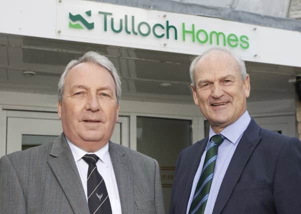 Keith Loades, Camanachd Association president, with Tulloch Homes chief executive George Fraser.