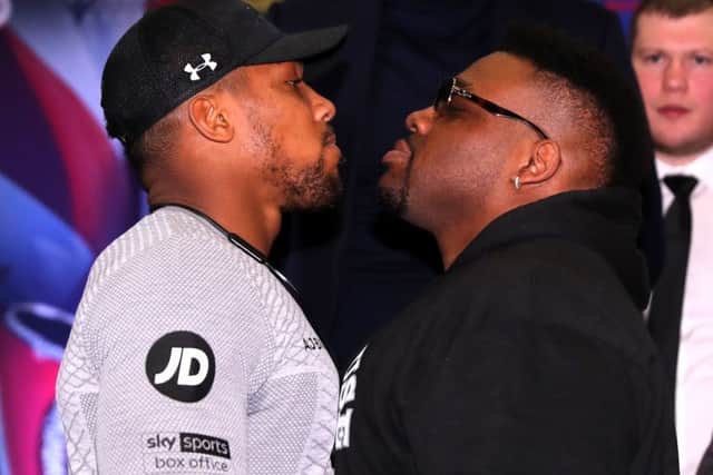 Anthony Joshua, left, and Jarrell Miller square up during a press conference in London. Picture: Getty.