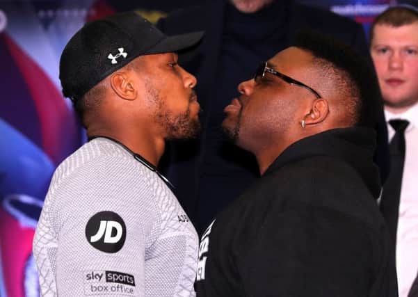 Anthony Joshua, left, and Jarrell Miller square up during a press conference in London. Picture: Getty.