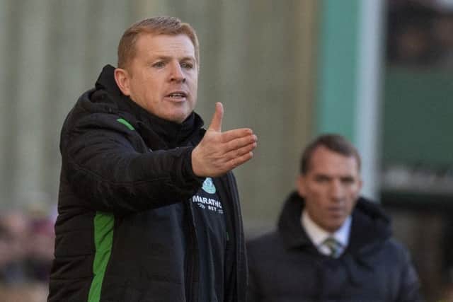 Neil Lennon directs his Hibs players during the 2-0 win over Celtic in December 2018 with Brendan Rodgers watching on in the background. Picture: SNS Group