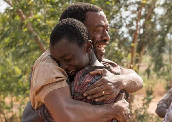 A still from The Boy Who Harnessed the Wind. Pictured: (L-R) Chiwetel Ejiofor as Trywell Kamkwamba and Maxwell Simba as William Kamkwamba. Picture: PA Photo/Netflix/Ilze Kitshoff