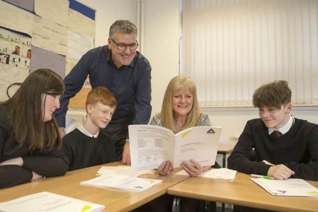Learning the ropes...Lesmahagow High School pupils get some advice from Helen and Cameron.