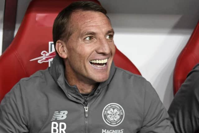 Brendan Rodgers is all smiles on the bench during the Europa League tie with RB Leipzig. Picture: Jens Meyer/AP