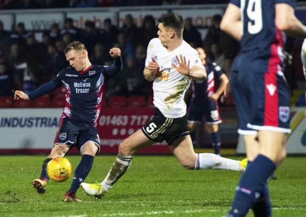 Ross County forward Billy Mckay strikes from distance to make it 2-1 to the hosts against Ayr. Picture: SNS.