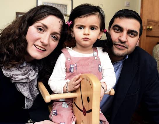 Katherine Behl with daughter Anya, who is 18 months, and father Abhishek. Picture: Lisa Ferguson