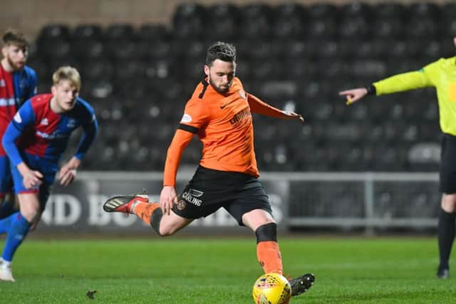 Nicky Clark scores a penalty for Dundee United to put them 1-0 in front against Inverness. Picture: SNS