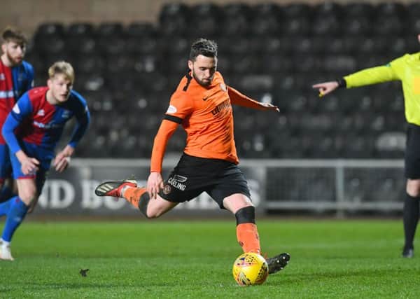 Nicky Clark scores a penalty for Dundee United to put them 1-0 in front against Inverness. Picture: SNS