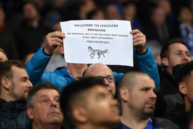 LEICESTER, ENGLAND - FEBRUARY 26: A fan holds a sign welcoming new Leicester City manager Brendan Rodgers during the Premier League match between Leicester City and Brighton & Hove Albion at The King Power Stadium on February 26, 2019 in Leicester, United Kingdom. (Photo by Michael Regan/Getty Images)